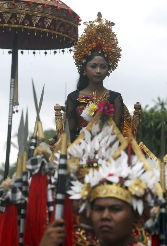 A member of Ubud royal family attends a funeral procession of Tjokorde Ngurah wim Sukawati, a deceased member of the Ubud Royal family, to the cremation ceremony in Ubud, Bali, Indonesia.