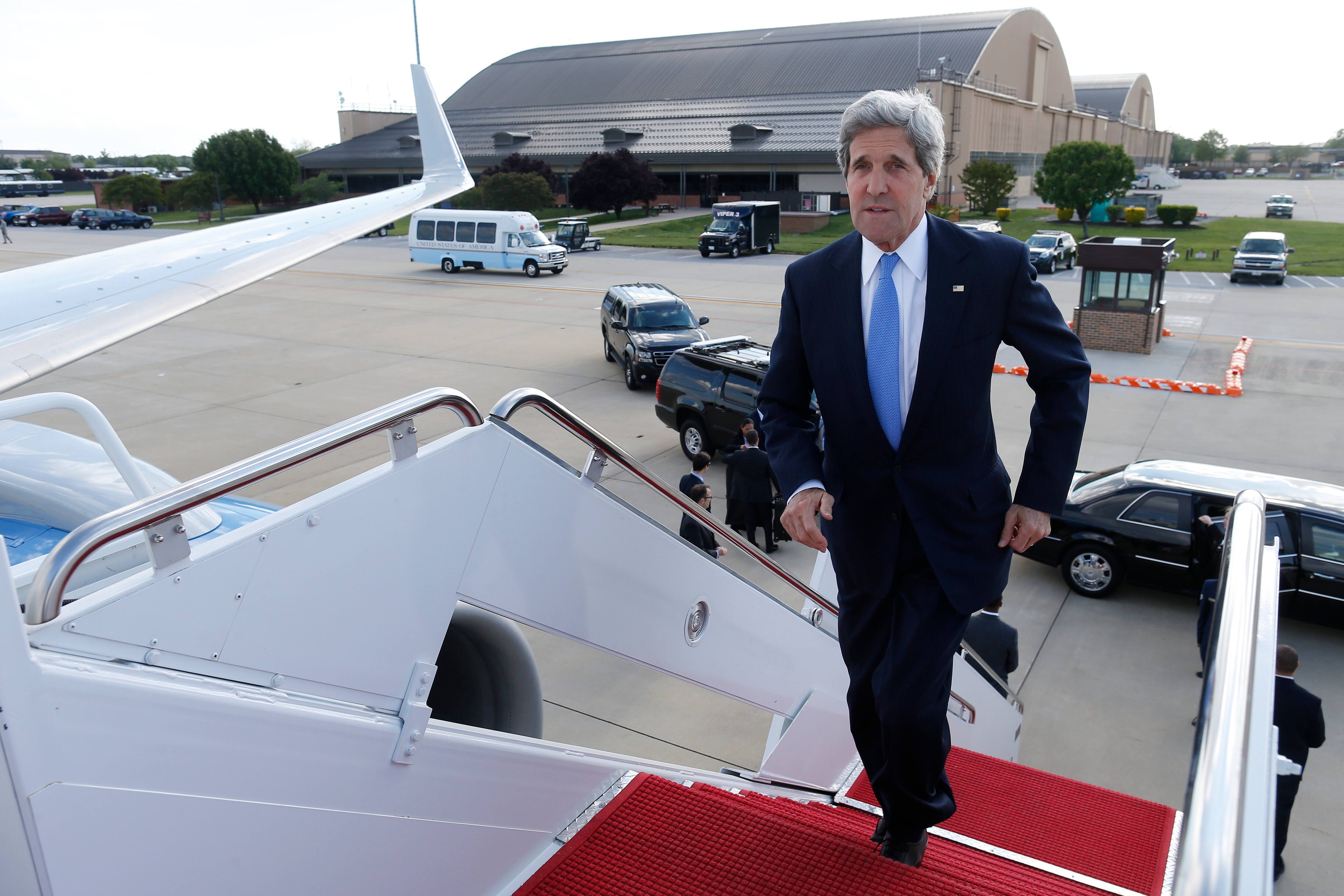Secretary of State John Kerry boards his plane at Andrews Air Force Base, Md., as he travels to Sweden for the Arctic Ministerial Summit.