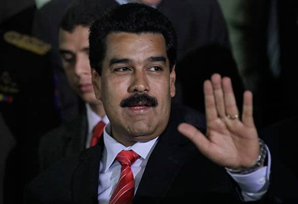 Venezuela`s President Nicolas Maduro, gestures at Miraflores Presidential Palace in Caracas, Venezuela. Maduro meet with China`s Vice President Ly Yuanchao to ratify agreements between Venezuela and China.