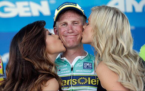 Lieuwe Westra of the Netherlands raises his gets a kiss on the podium after winning the first stage of the Tour of California cycling race over a 102.6 mile loop, starting and finishing in Escondido, Calif.