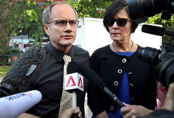Parents of the late American Shane Todd, Mary, right, and Rick Todd, left, arrive to waiting press at the Subordinate Courts in Singapore.