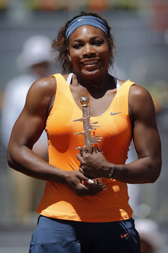 Serena Williams from the US poses with her trophy during the awards ceremony after winning the final of the Madrid Open tennis tournament against Maria Sharapova from Russia, in Madrid.