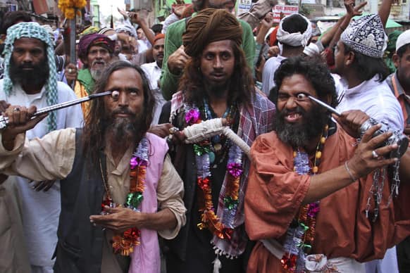 Muslim Sufi devotees use sharp objects as they self flagellate during a procession to mark the death anniversary of Sufi Muslim saint Hazrat Khwaja Muinuddin Chishti, in Ajmer.
