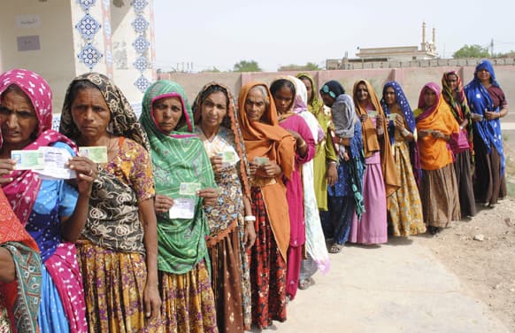Pakistani women line up outside a polling station waiting to cast their ballots in Hyderabad, Pakistan.