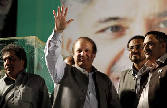 Pakistan`s former Prime Minister Nawaz Sharif waves to his supporters during an election rally in Rawalpindi, Pakistan.