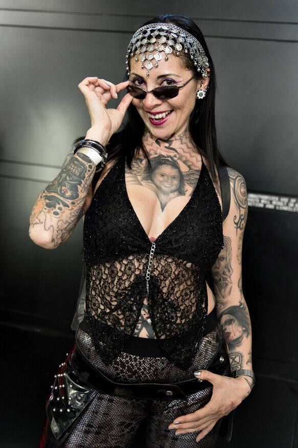 `Black Widow` from Colombia who is a tattoo artist and works in a friend`s tattoo shop in Copenhagen, displays her tattoos during the third Copenhagen Ink Festival.