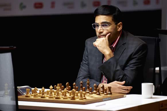 Viswanathan Anand, considers his move as he plays against Norway`s Magnus Carlsen, unseen, in the Norway Chess 2013 tournament in Sandnes near Stavanger, Norway.