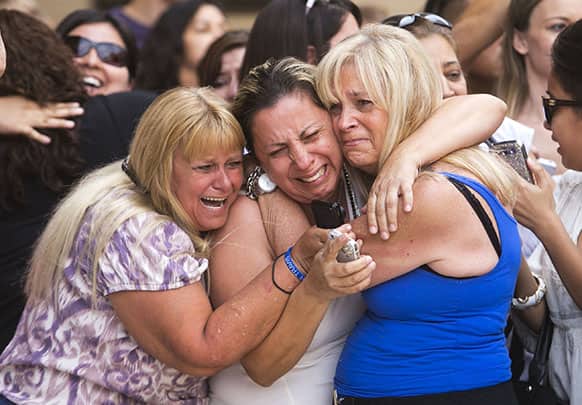 From left, Kathy Brown, of Paradise Valley, Virginia Aguiar, of Scottsdale, Jane Crook, of Scottsdale, react to a guilty verdict for Jodi Arias.