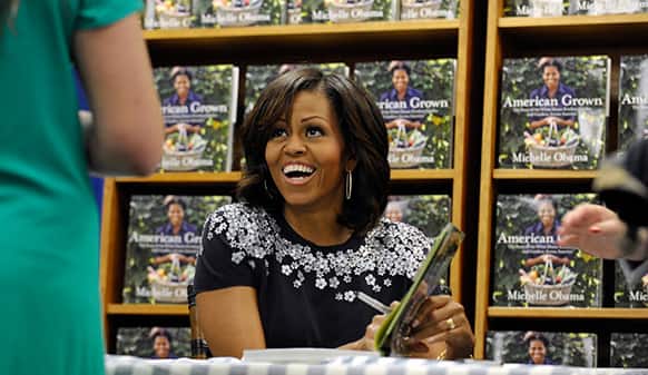 First lady Michelle Obama signs copies of her book