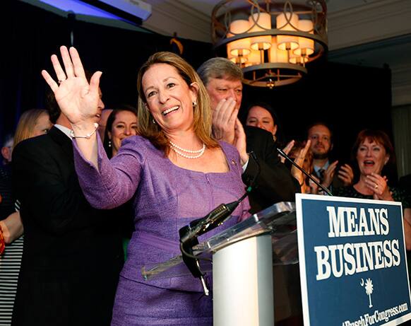 1st Congressional District Democratic candidate Elizabeth Colbert Busch gives her concession speech at the Charleston Renaissance Hotel after losing to Republican Mark Sanford, in Charleston S.C. Behind her, at right, is her husband Claus Busch.