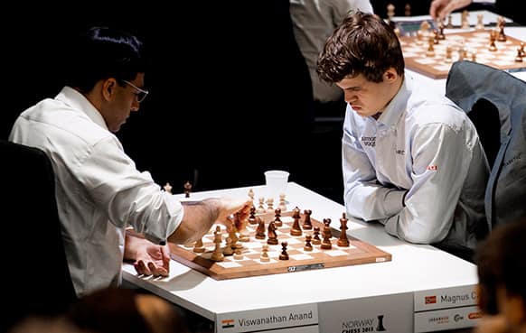 India`s Viswanathan Anand, left, plays against Norway`s Magnus Carlsen during the Norway Chess competition 2013 in Sandnes near Stavanger, Norway.