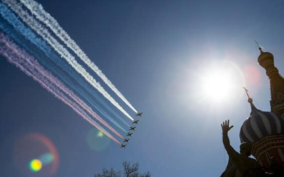 Russian army jet fighters and a cargo plane fly over the Red Square and St. Basil Cathedral, right, during a rehearsal for the Victory Day military parade which will take place at Moscow`s Red Square on May 9 to celebrate 68 years of the victory in the WWII, in Moscow, Russia.