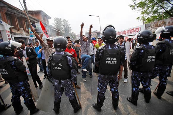 Nepalese students shout slogans against government`s decision that President Ram Baran Yadav endorses Lok Man Singh Karki’s nomination to the top of the Commission for the Investigation of Abuse of Authority (CIAA), in Katmandu, Nepal.