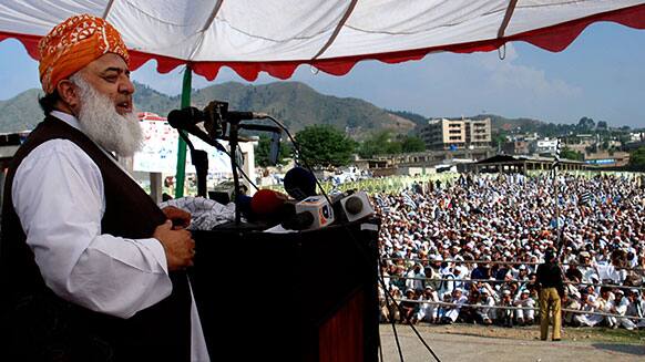 Leader of religious political party Jamiat-ul-Islam, Fazal-ur-Rehman speaks during an election rally in Manshera, Pakistan.