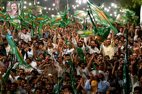 Supporters of Pakistan Muslim League-N party cheer their leader, Nawaz Sharif, not pictured, during an election campaign rally in Islamabad, Pakistan.
