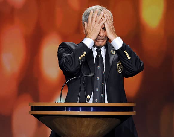 Golfer Fred Couples becomes emotional as he speaks during his induction into the World Golf Hall of Fame in St. Augustine, Fla.