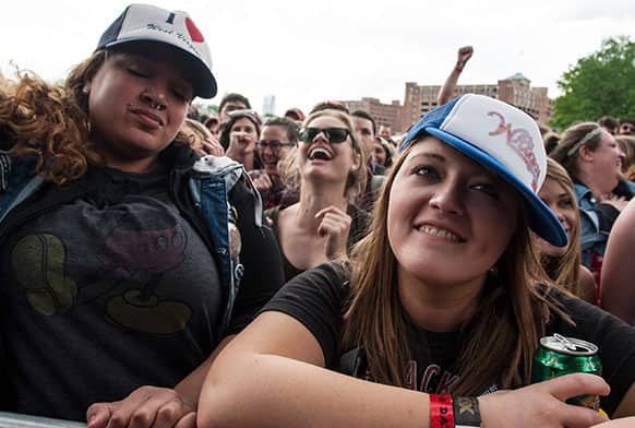 Shannon Petree, right, of Huntington West Virginia, watches the band Delta Spirit perform during the inaugural Shaky Knees Music Festival in Atlanta.