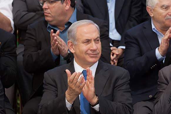 Israeli Prime Minister Benjamin Netanyahu applauds as he attends the weekly cabinet meeting at the Herzl Museum, in Jerusalem, Israel.