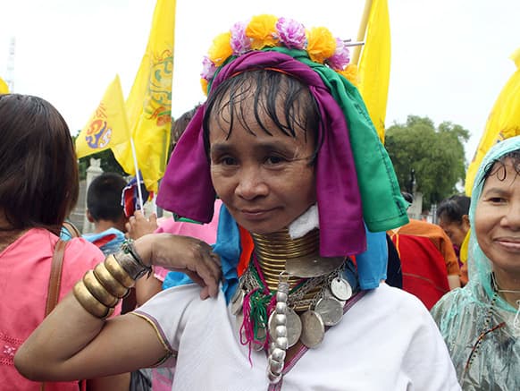 Ma Se, 40, a long neck hilltribe woman, joins a gathering to honor Thailand`s King Bhumibol Adulyadej during the coronation day celebrations in Bangkok, Thailand.