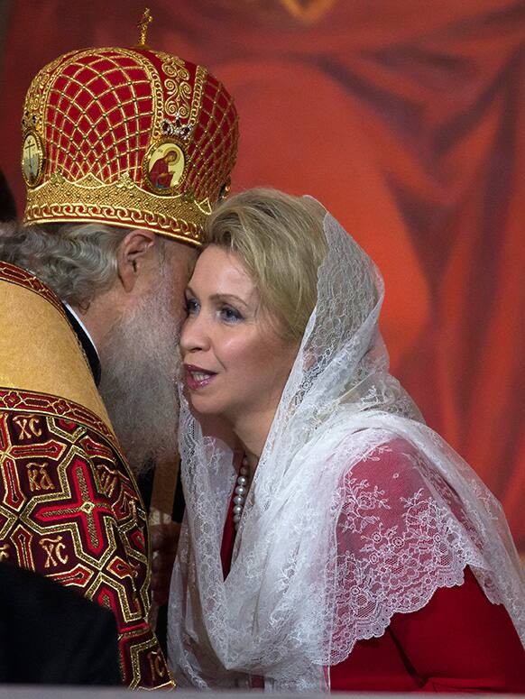 Russian Orthodox Patriarch Kirill, left, greets Prime Minister Dmitry Medvedev`s wife Svetlana during an Easter service in the Christ the Savior Cathedral in Moscow.