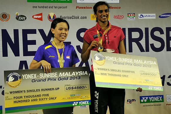 India`s P.V. Sindhu, right, pose with Singapore Juan Gu during the awards ceremony after the Malaysia Grand Prix Gold 2013 badminton in Kuala Lumpur.