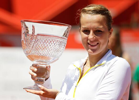 Russia`s Anastasia Pavlyuchenkova holds the trophy after winning the Portugal Open final tennis match in Oeiras, outside Lisbon. Pavlyuchenkova defeated Spain`s Carla Suarez Navarro 7-5, 6-2.