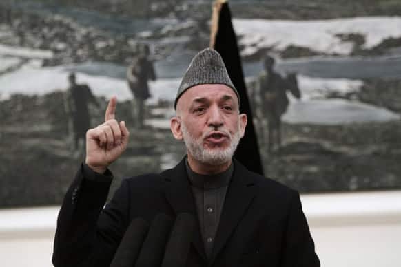 Afghan President Hamid Karzai speaks during a news conference in Kabul. Karzai says the director of the CIA assured him that regular funding his government receives from the agency will not be cut off.
