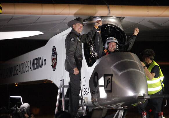 Solar Impulse co-founder, pilot and CEO Andre Borschberg greets pilot Bertrand Piccard at Sky Harbor International Airport in Phoenix, after completing the first leg of its coast-to-coast flights across the US. It is the first time that a solar airplane capable of flying day and night without fuel, will attempt to fly across America.