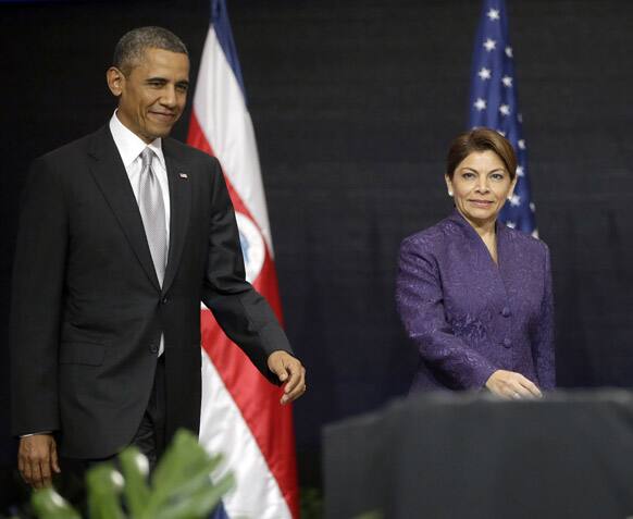President Barack Obama and Costa Rica President Laura Chinchilla arrive for a news conference at the National Center for Art and Culture in San Jose, Costa Rica.