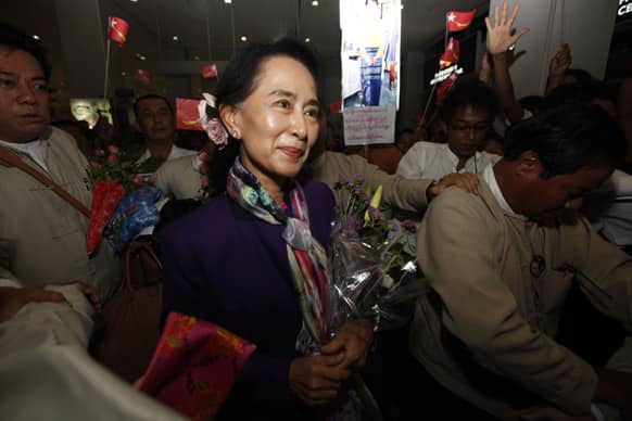 Myanmar Opposition Leader Aung San Suu Kyi arrives at Yangon International Airport, Myanmar, as she returns from Mongolia.