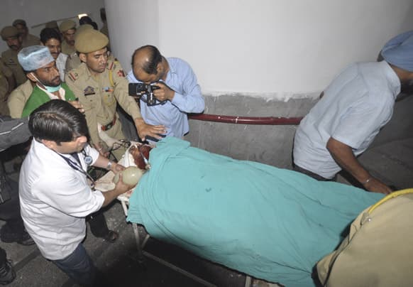 Pakistani prisoner Sanaullah is carried on a stretcher to a hospital for treatment in Jammu. Sanaullah in a local jail in Kashmir has been