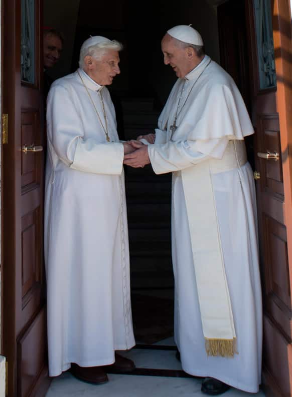 Pope emeritus Benedict XVI, left, is welcomed by Pope Francis as he returns at the Vatican from the pontifical summer residence of Castel Gandolfo, 35 km South-Est from Rome.