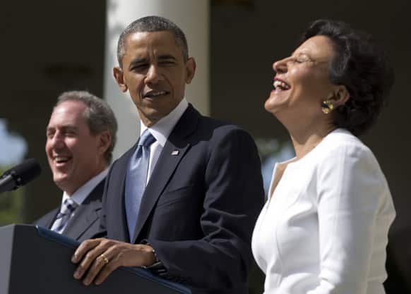 President Barack Obama looks to longtime fundraiser and philanthropist Penny Pritzker, as she laughs in the Rose Garden of the White House in Washington, where he announced he would nominate Pritzker to run the Commerce Department.