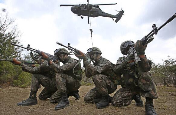 South Korean army soldiers aim their weapons during a military exercise in Yeong Cheon, South Korea.