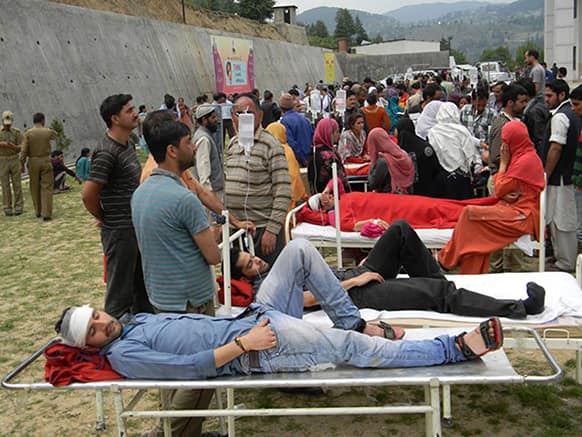 Patients are evacuated from a hospital after a magnitude-5.4 earthquake in Bhaderwah area, in Indian-controlled Kashmir.