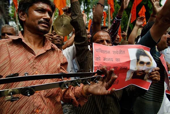Indian activists of right-winged Shiv Sena shout slogans against the Pakistan government during a protest against an attack on an Indian prisoner in a Lahore prison, in Jammu, India.