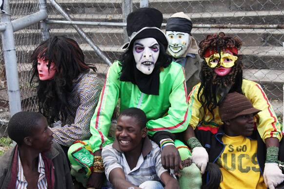 Traditional Nyau dancers are seen before performing at an International Workers Day rally in Harare, Zimbabwe.