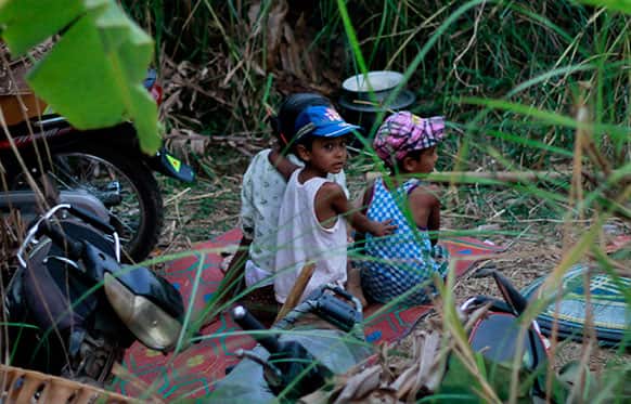 Muslim children take refuge in forests along a road in Okkan, about 70 miles (110 kilometers) north of Yangon, Myanmar.