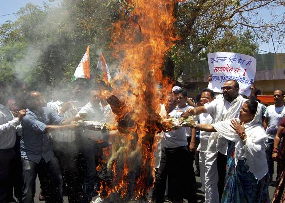 Opposition Congress party activists burn an effigy of Madhya Pradesh state chief minister Shivraj Singh Chauhan as they protest after a five-year-old girl died after being raped in Bhopal.