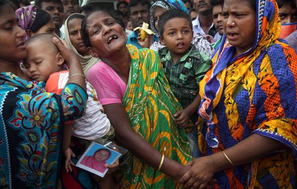 A woman grieves for her daughter-in-law who was trapped in the collapsed garment factory building, in Savar, near Dhaka, Bangladesh.