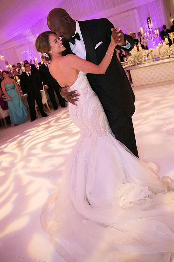 Charlotte Bobcats owner Michael Jordan dances with his bride Yvette Prieto during their wedding reception at the Bear`s Club in Jupiter, Fla.