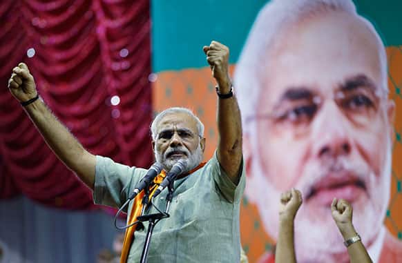 India`s main opposition Hindu nationalist Bharatiya Janata Party (BJP) leader Narendra Modi gestures during a campaign rally for the upcoming state elections in Bangalore.
