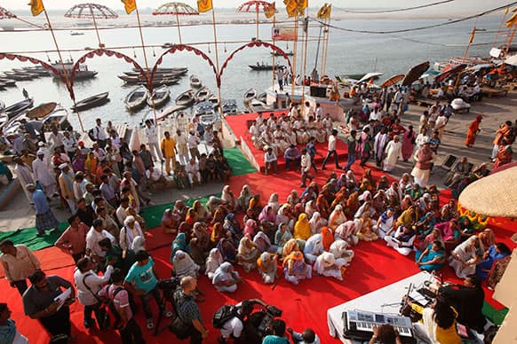 Elderly Indian widow prays during a function organized by Sulabh International on the bank of Holy river Ganga in Varanasi.
