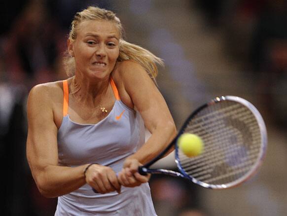 Maria Sharapova from Russia returns a ball to Na Li from China during the final of the WTA tennis Porsche GP in Stuttgart, Germany.