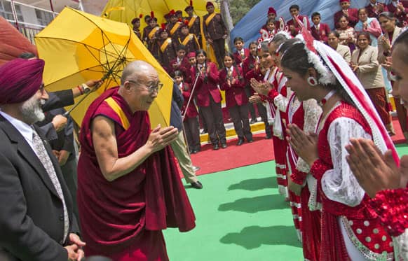 Schoolchildren welcome Tibetan spiritual leader the Dalai Lama, at the Dalhousie Public School in Dalhousie, about 130 kilometers (80 miles) northwest of Dharmsala.