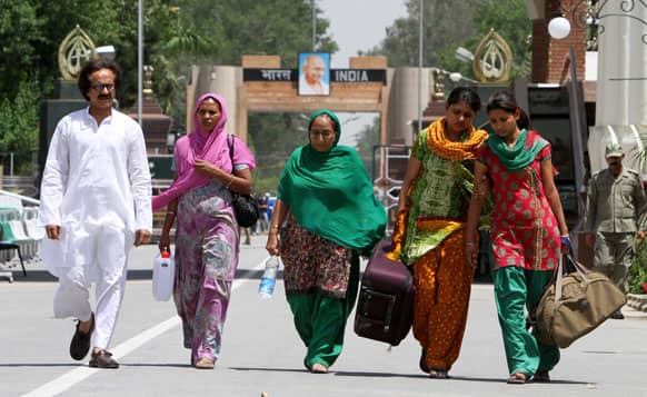 Dalbir Kaur, sister of Sarabjit Singh arrives with Singh`s family members at Pakistan`s Wagah border post. Singh who is on death row was critically injured when he was attacked with a brick inside a prison in the eastern city of Lahore.