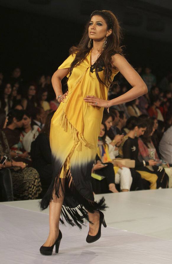 A Pakistani model presents a creation by designer Ayesha F Hashwani during Lahore Fashion Week. Dozens of designers, brands and textile houses are presenting their collections during the four-day Lahore Fashion Week sponsored by the Pakistan Fashion Design Council.
