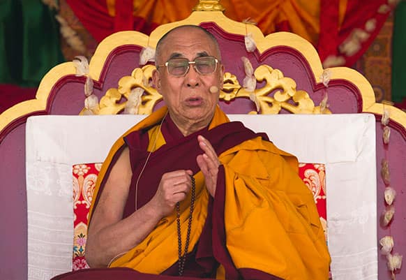 Tibetan spiritual leader the Dalai Lama prays during a religious talk at the Central School for Tibetans in Dalhousie, about 128 kilometers (80 miles) north-west of Dharmsala, India.