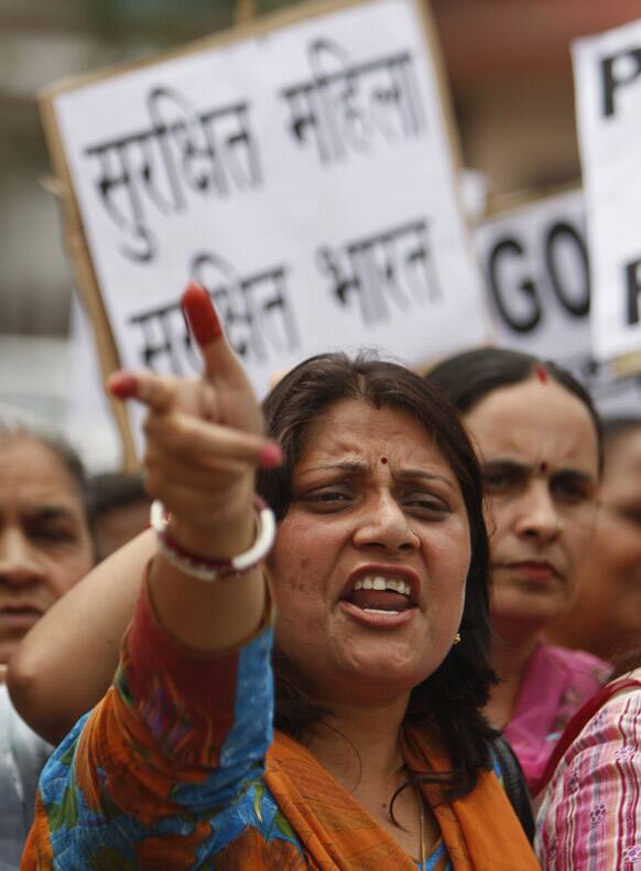 A woman activist of Bharatiya Janata Party shouts slogans during a protest against the brutal rape and assault of a five-year-old girl in New Delhi.