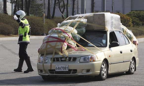 A South Korean vehicle fully loaded with goods and products brought back from North Korea`s Kaesong industrial complex arrives at the customs, immigration and quarantine office near the border village of Panmunjom in Paju, South Korea.